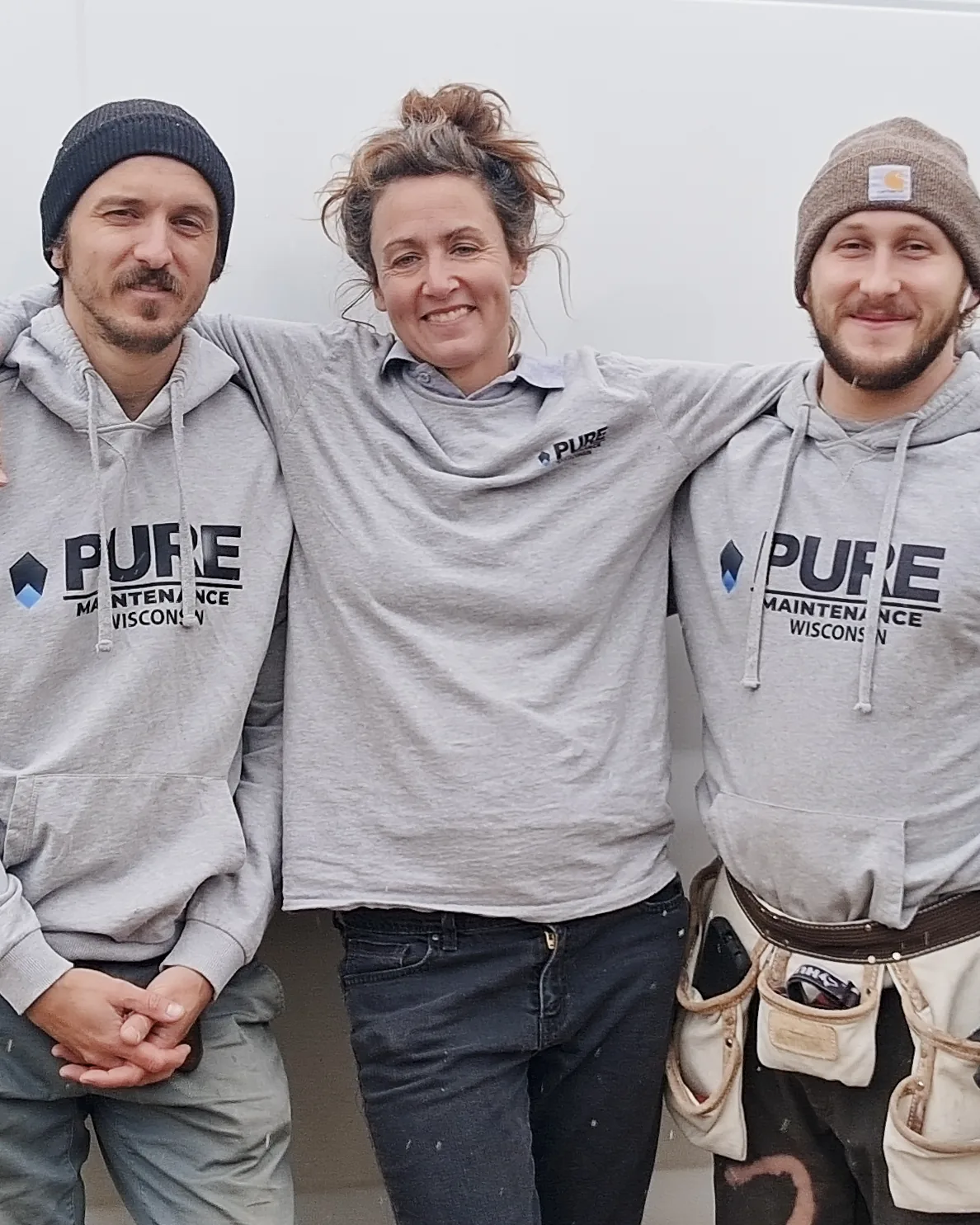 Courtney Jarman with a crew member beside the Pure Maintenance Wisconsin van