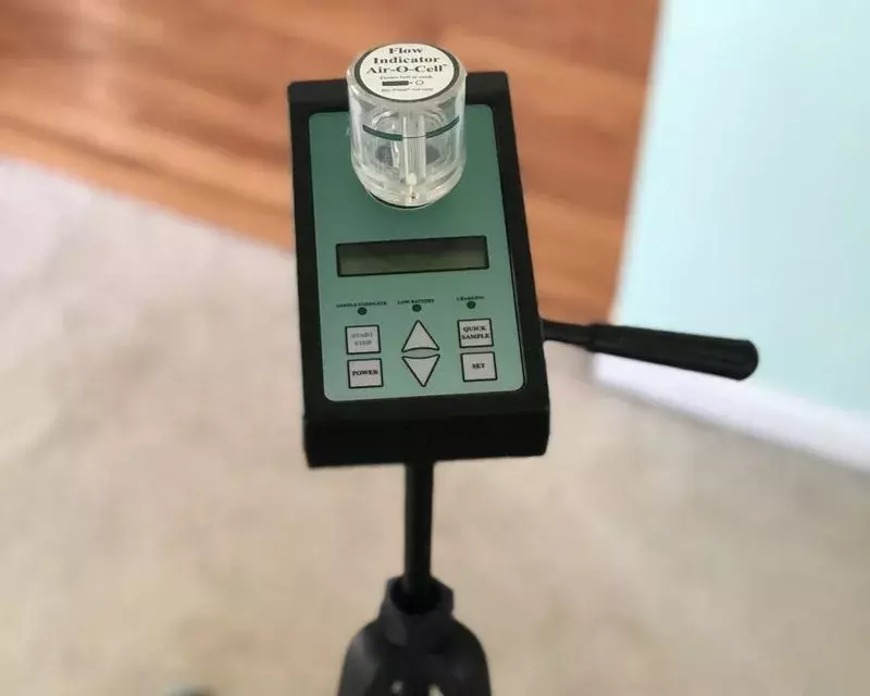 An air sampling pump on a tripod