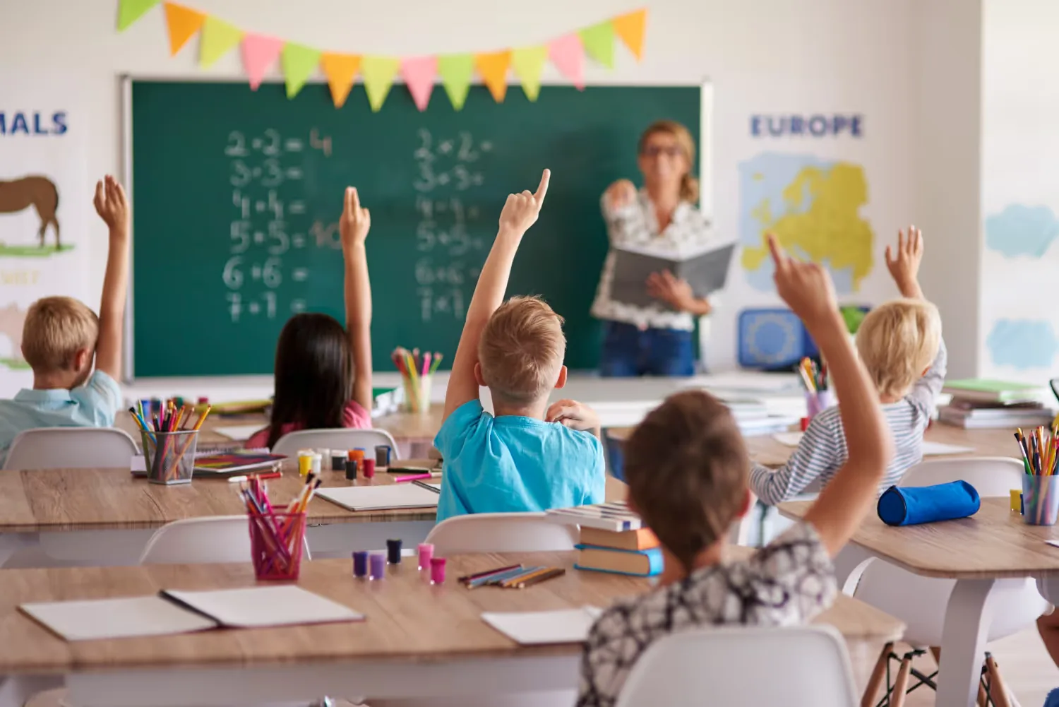 A teacher and pupils in a classroom