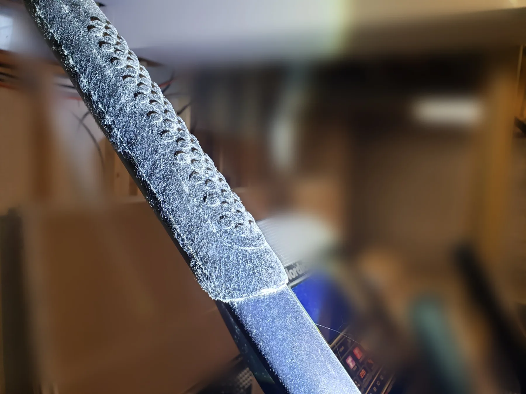 Mold growth on a metal fitting inside a home