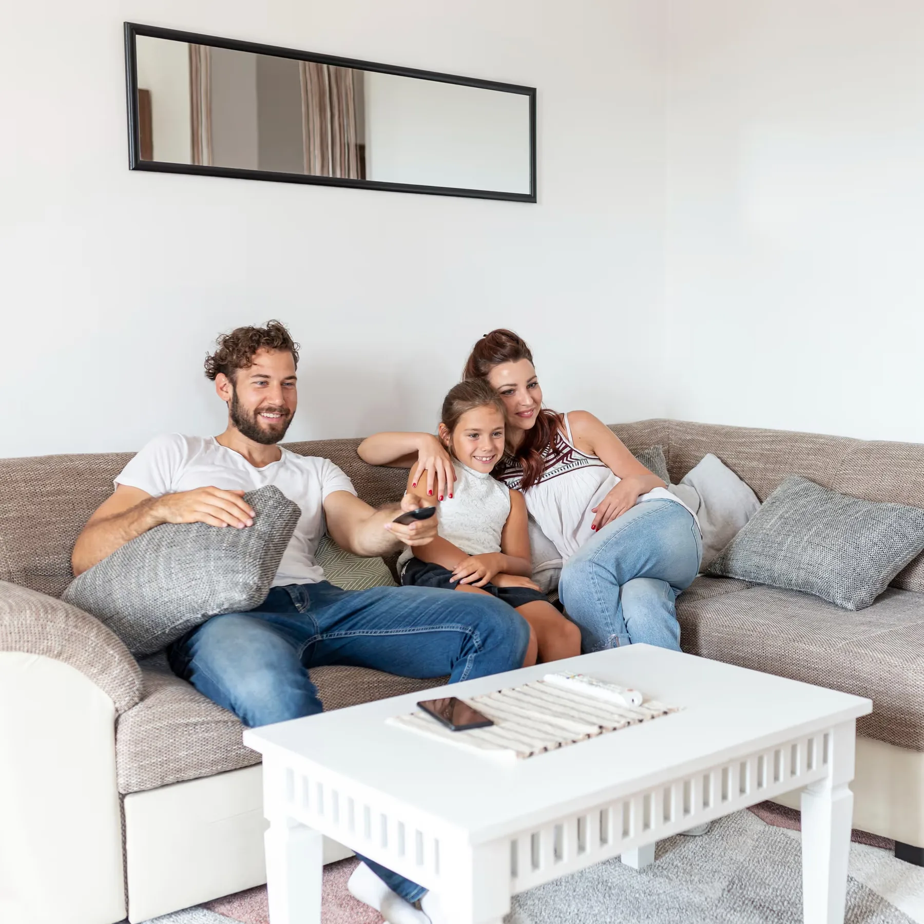 A family relaxing together on a sofa