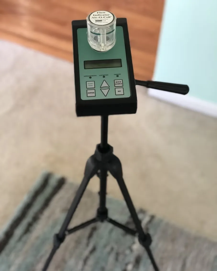 An air sampling pump on a tripod