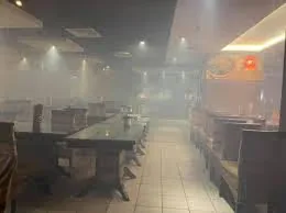 A restaurant dining room filled with vapor